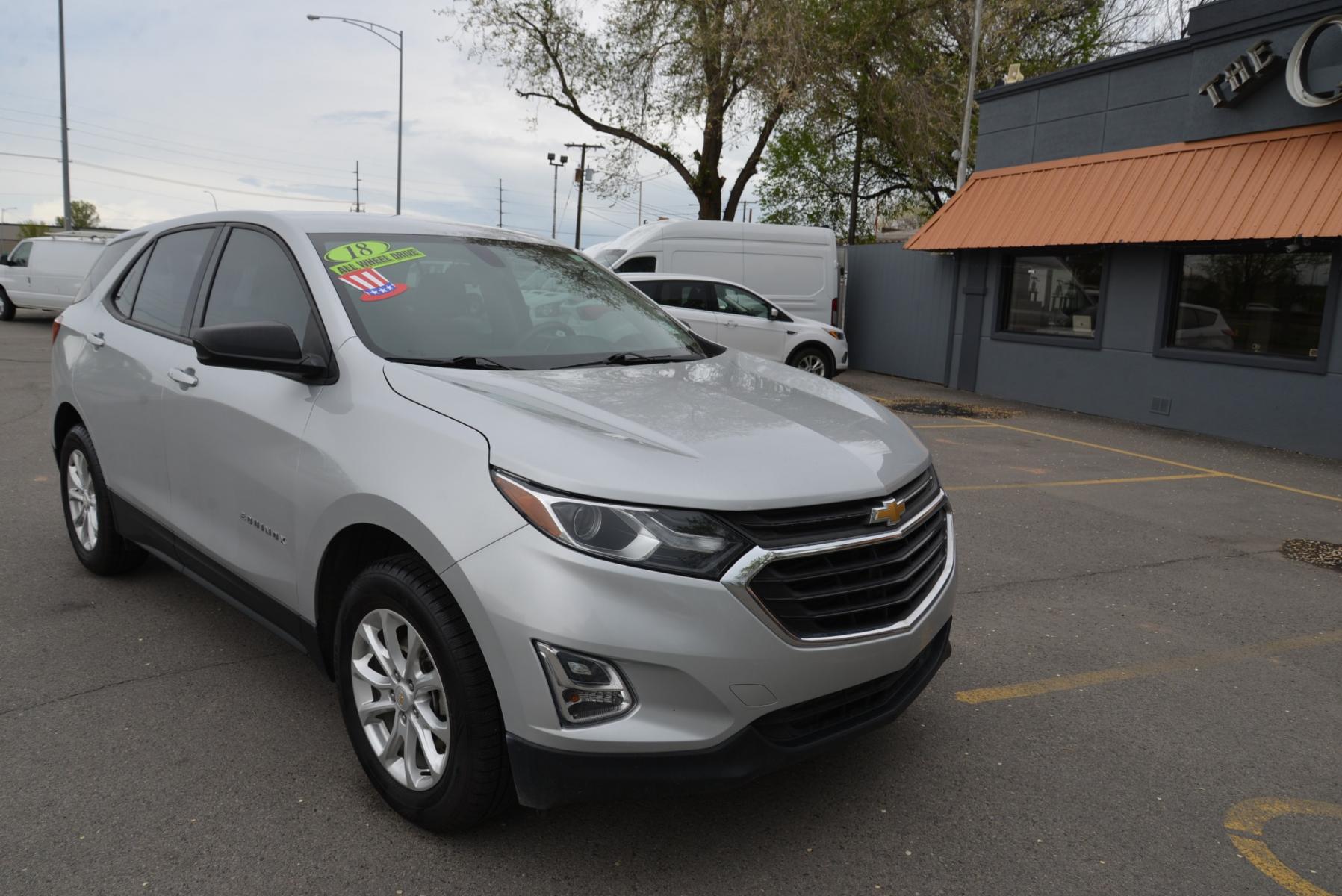 2018 Silver /Gray Chevrolet Equinox LS AWD (2GNAXREV3J6) with an 1.5L Turbo 4 cylinder engine, 6 speed automatic transmission, located at 4562 State Avenue, Billings, MT, 59101, (406) 896-9833, 45.769516, -108.526772 - 2018 Chevrolet Equinox AWD - One owner - Low miles! 1.5 Turbo 4cylinder engine - 6 speed automatic transmission - All wheel drive - LS package - 63,527 miles - One owner! LS package - air conditioning - tilt and telescoping steering wheel - cruise control - touchscreen blue tooth audio - steer - Photo #2